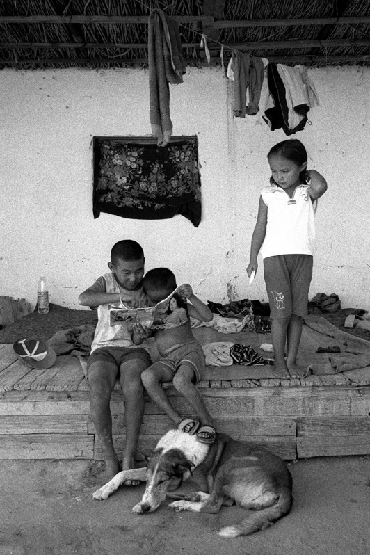 Children in the courtyard, Tastubek village, Aralsk district, Kyzyl-Orda region, Kazakhstan. August 2001