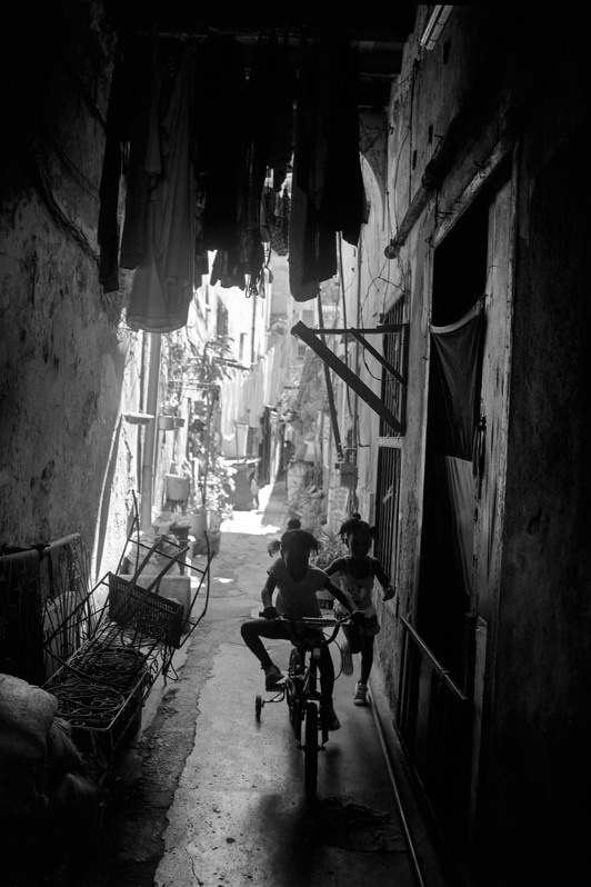 Two girls playing in the neighbourhood community, Centro Habana district, Havana, Cuba. 2021