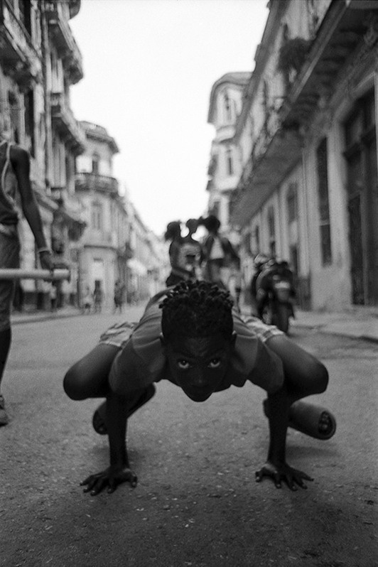 Portrait of a child playing in the street, Centro Habana district, Havana, Cuba. 2022