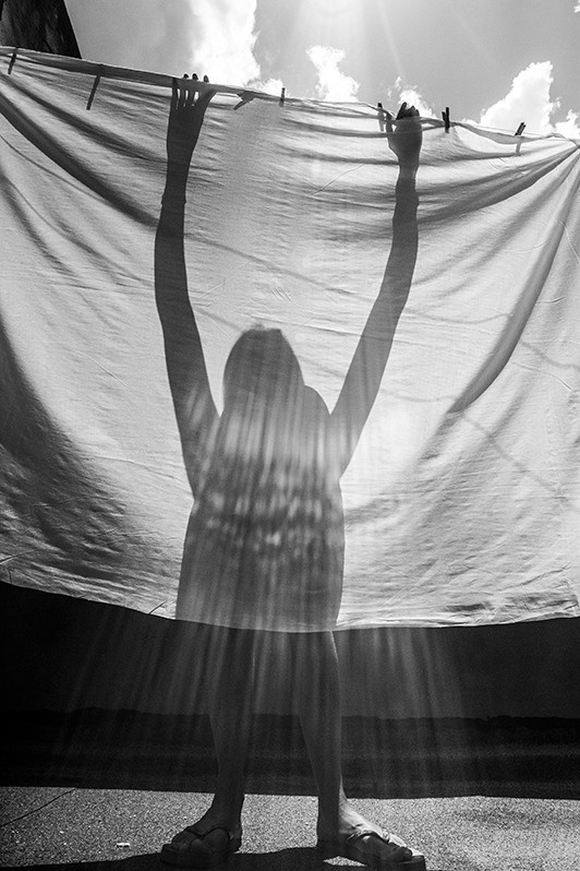 My mum doing housework in our old house, Reina street, Centro Habana district, Havana, Cuba. 2016