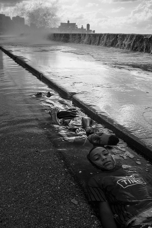 Locals travelled to the Malecon to refresh themselves with seawater that flooded the seafront in the aftermath of Hurricane Ian, Centro Habana district, Havana, Cuba. 2022