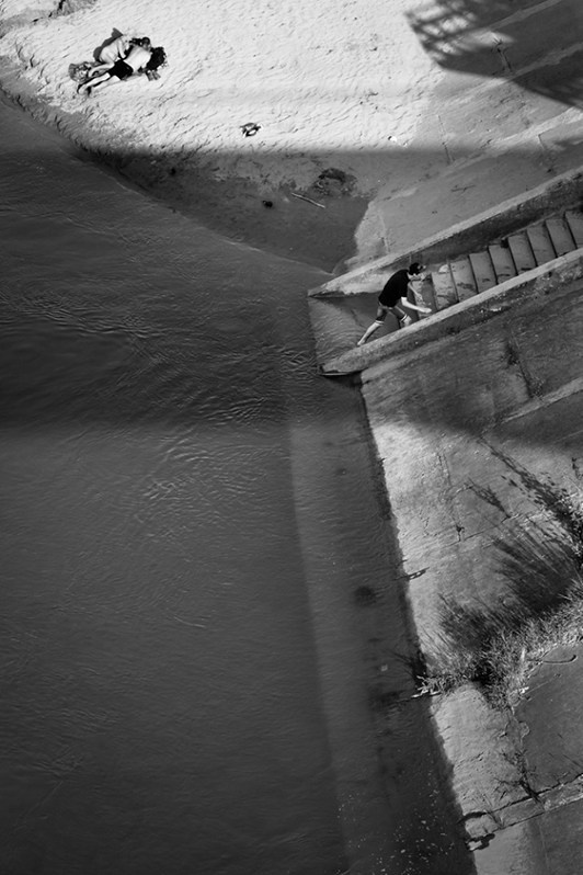 BathingSummer holiday on the beach along the Dniestr river in Tiraspol, Transnistria, July 2014