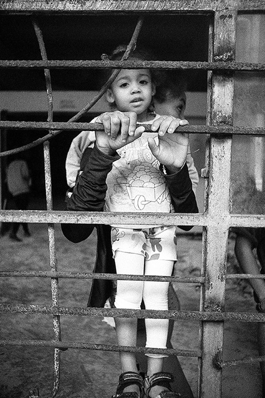 Portrait of a mother and daughter in a building on Reina street, Centro Habana district, Havana, Cuba. 2023