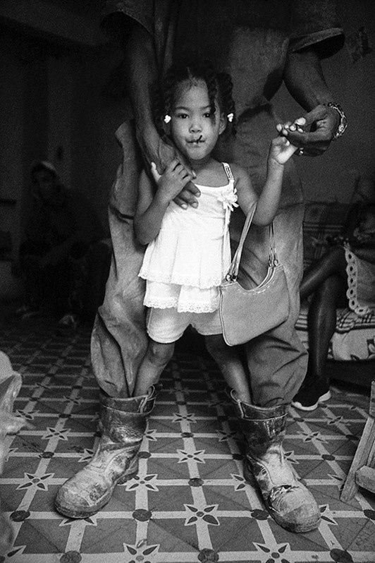 Portrait of a young girl in her home, Centro Habana district, Havana, Cuba. 2022