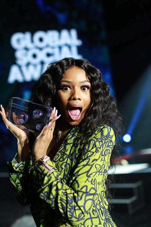 Bonang Matheba with an award at the Global Social Awards, Prague.