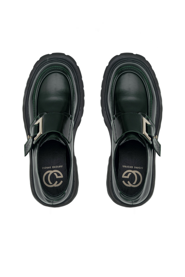 Black loafers seen from above on white