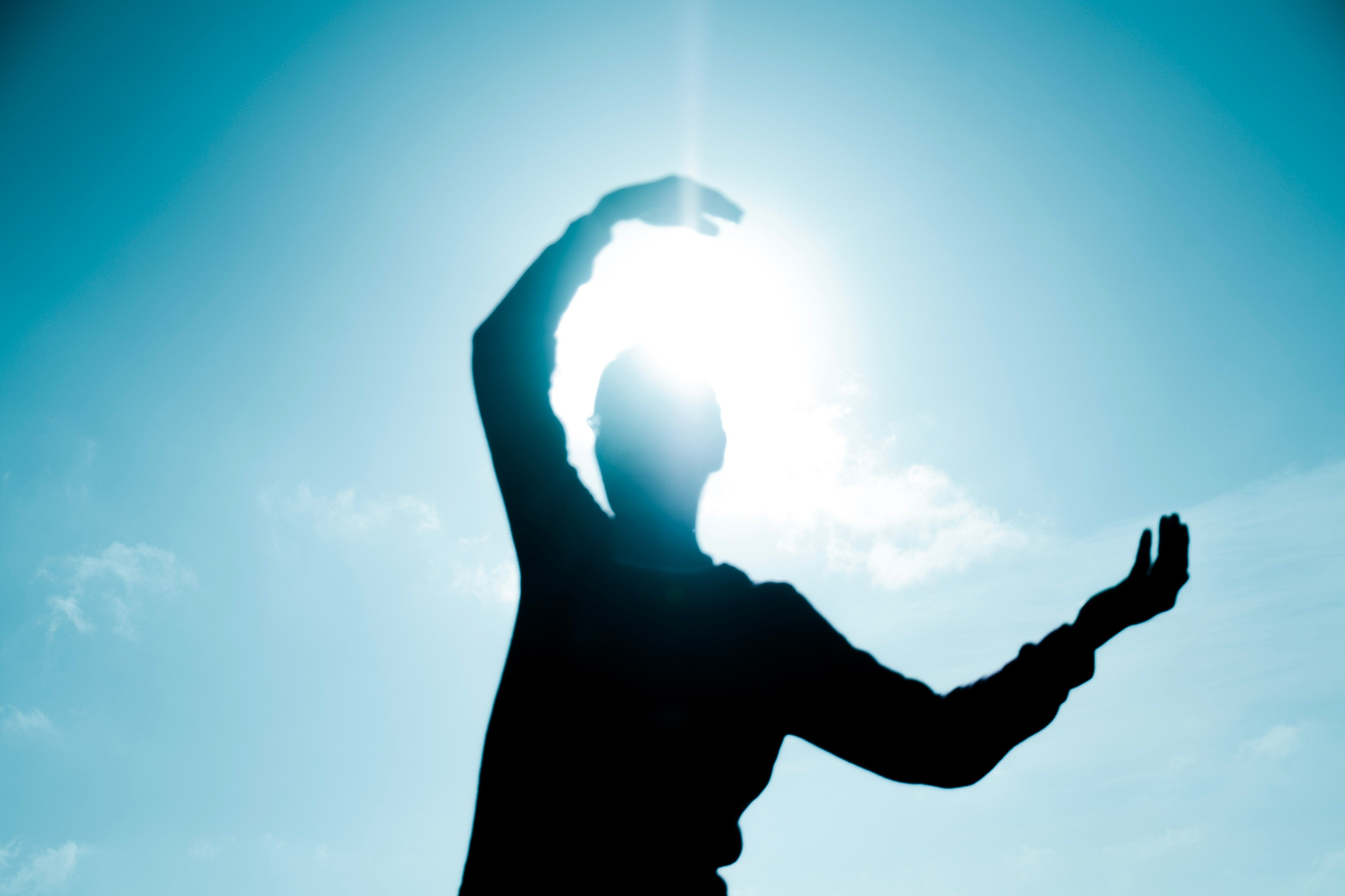 Creative movement based artistic portrait expressing freedom and light outdoors