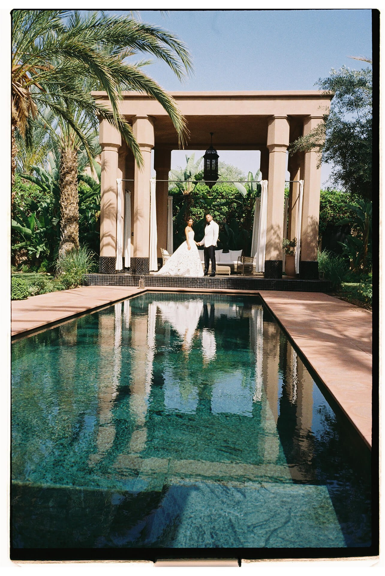 Couple by reflecting pool in Morocco