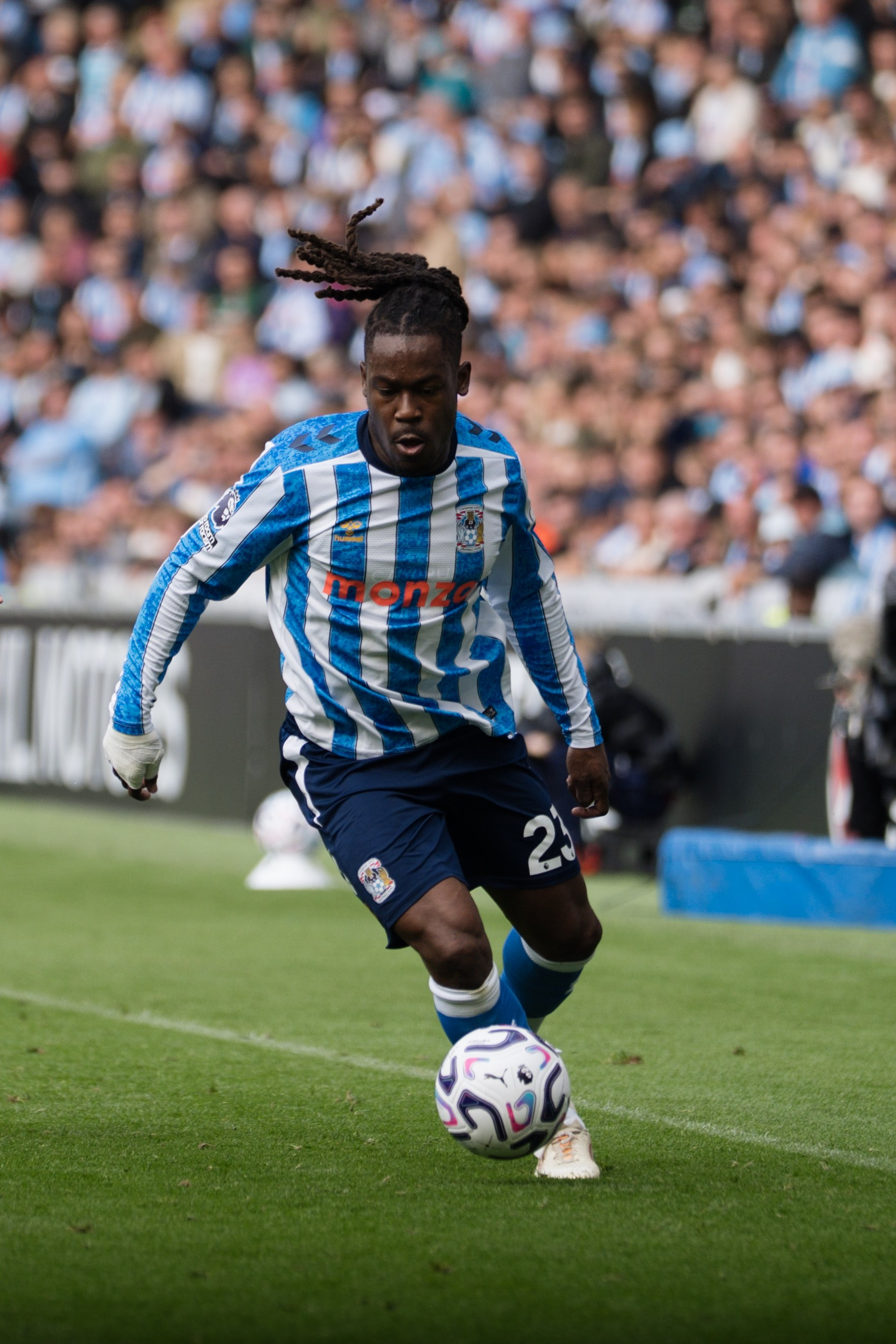Coventry City player carrying the ball during the Premier League match against Hull City at the Coventry Building Society Arena