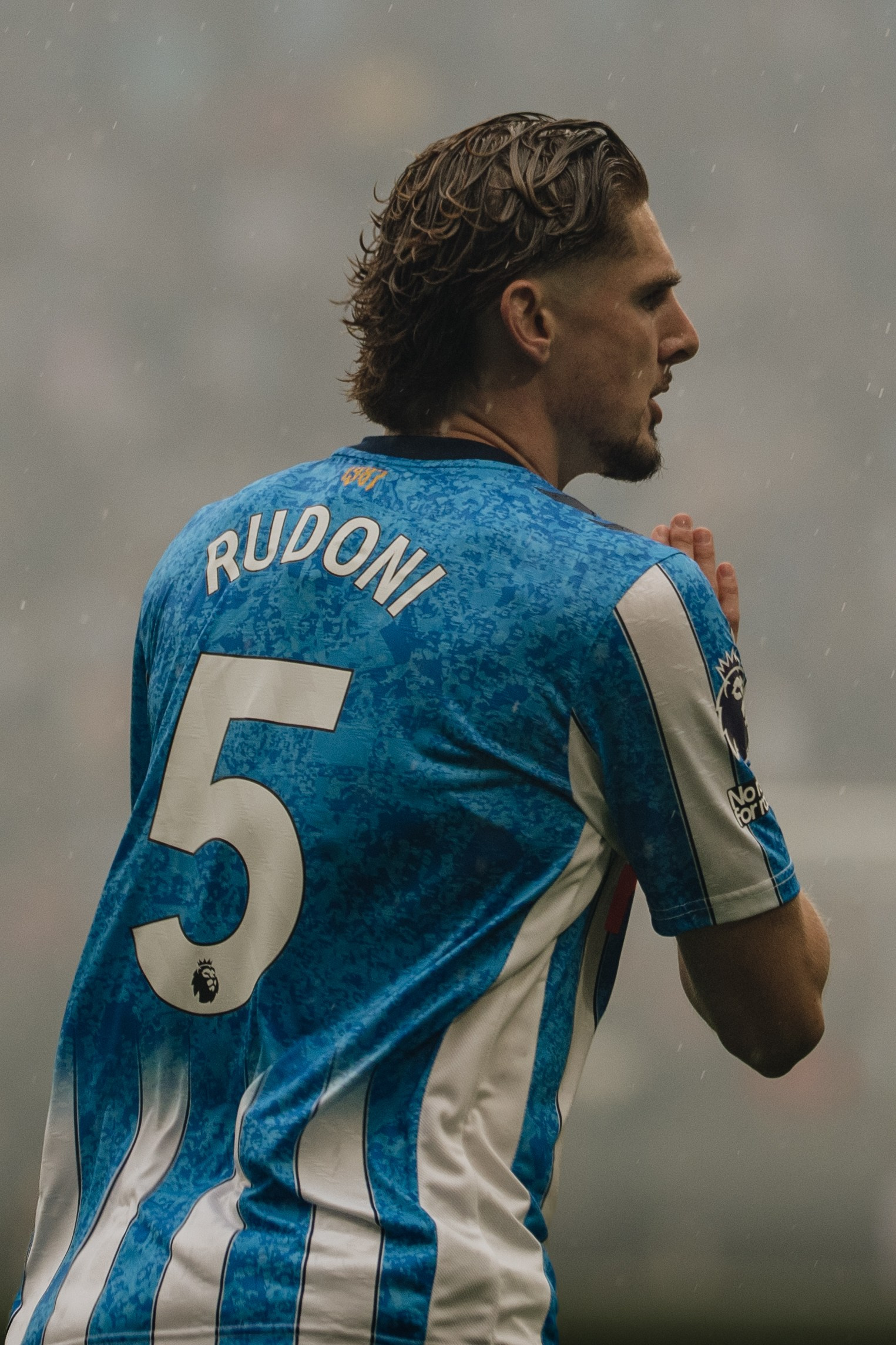 Coventry City player  Jack Rudoni wearing number 5 photographed from behind during a professional football match.