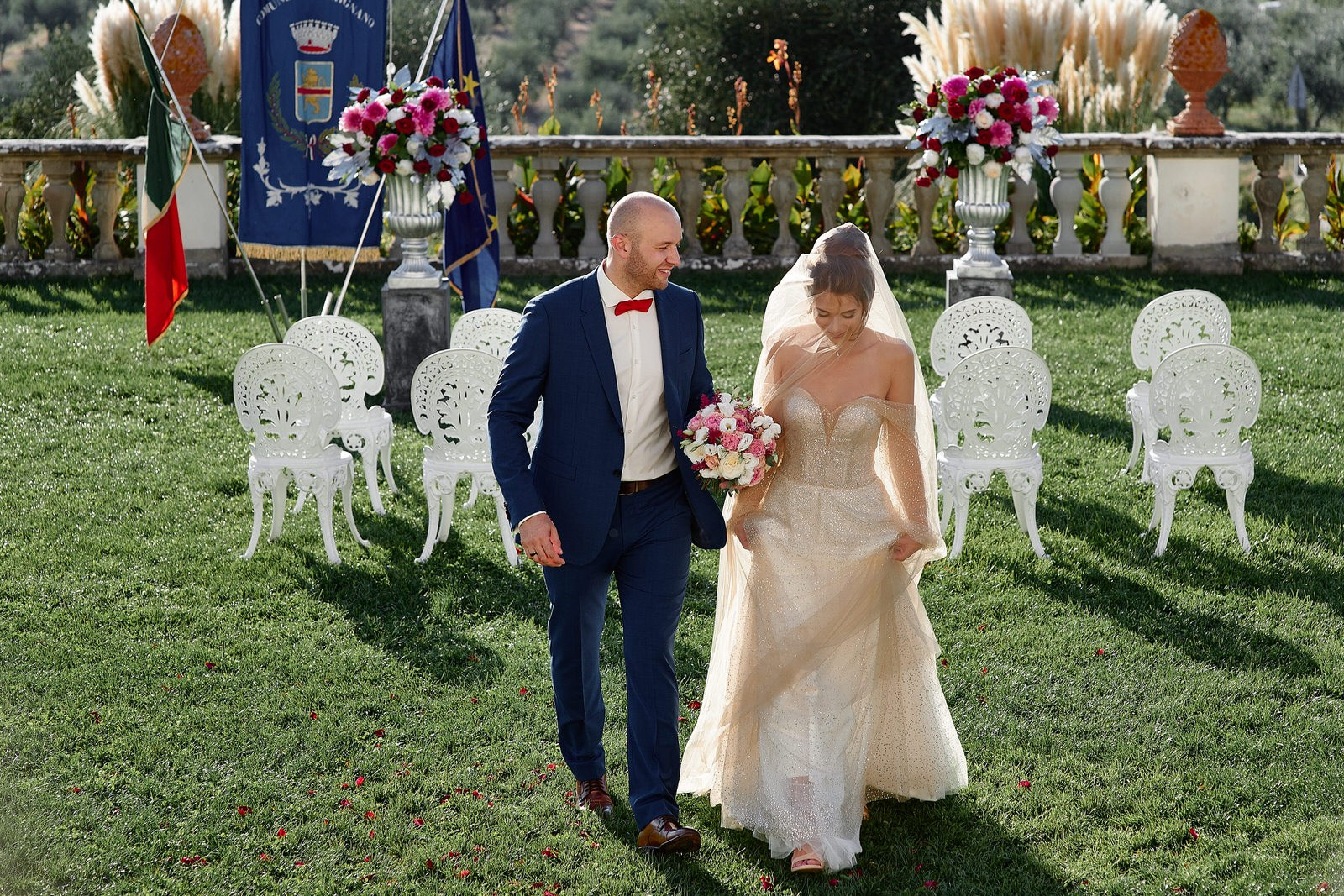 Ekaterina and Danil golden hour portrait at Villa Medicea La Ferdinanda — warm amber light on Renaissance stone walls, Tuscany wedding photography