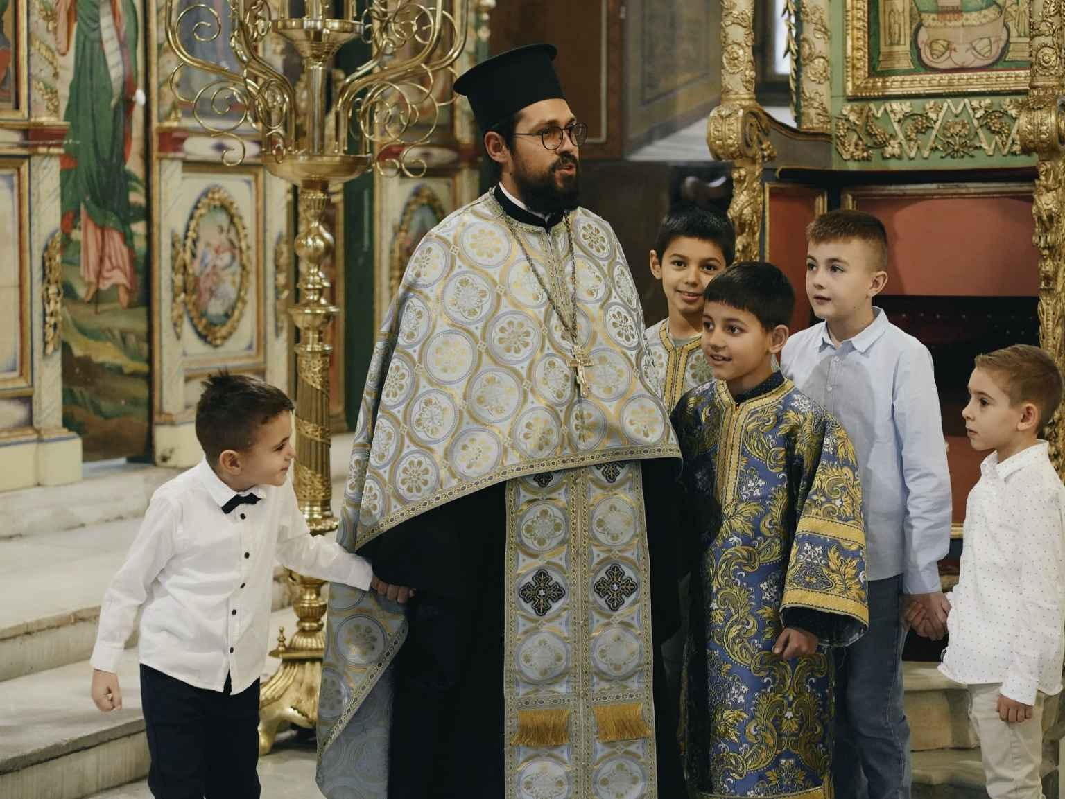 children listening priest church ceremony candid moment