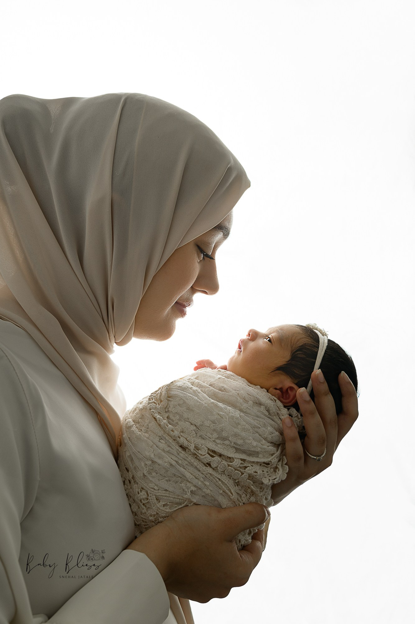 mother's love showing mother and newborn baby girl together in soft and neutral aesthetic image.