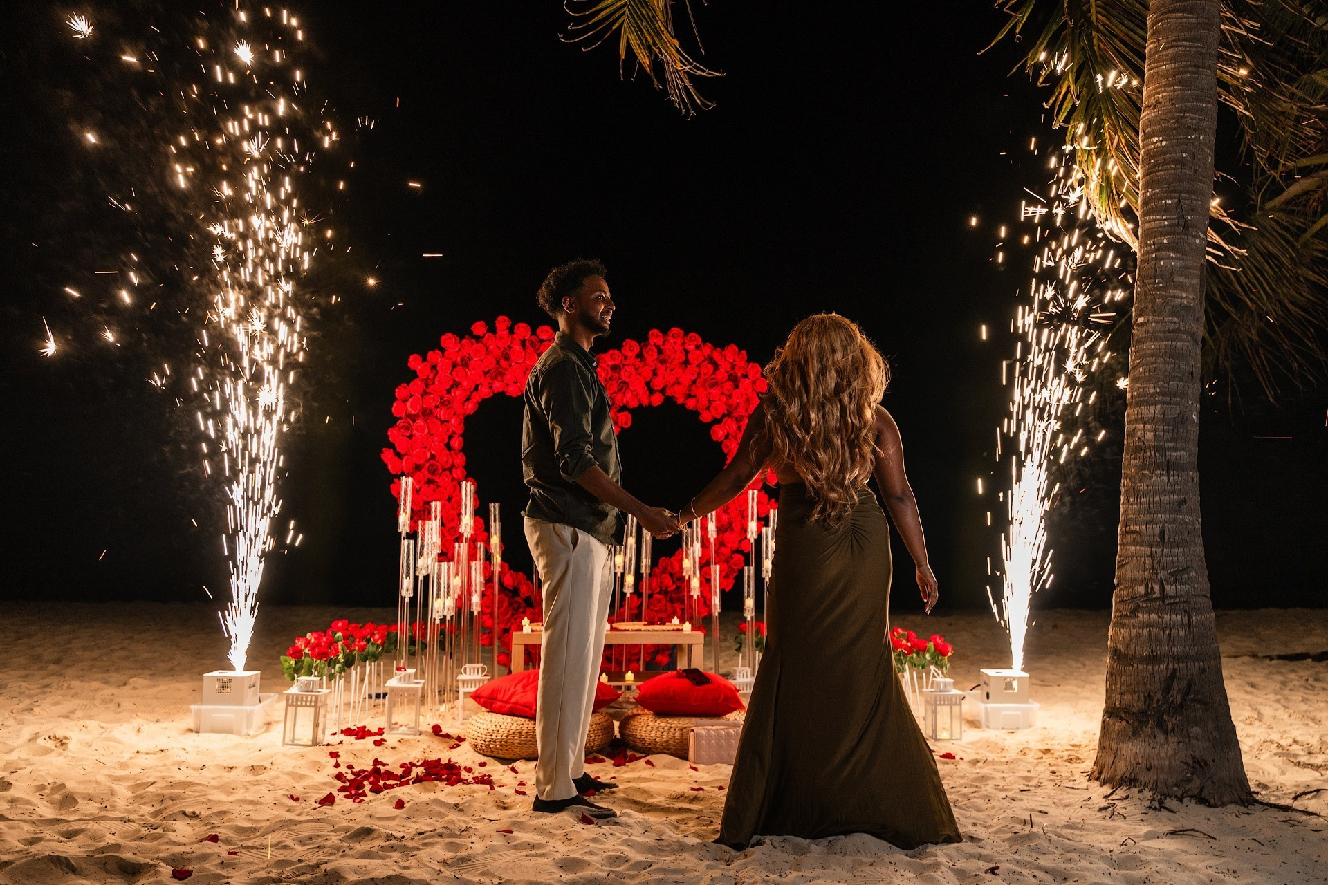 Exclusive luxury engagement experience in Punta Cana with red rose floral arch