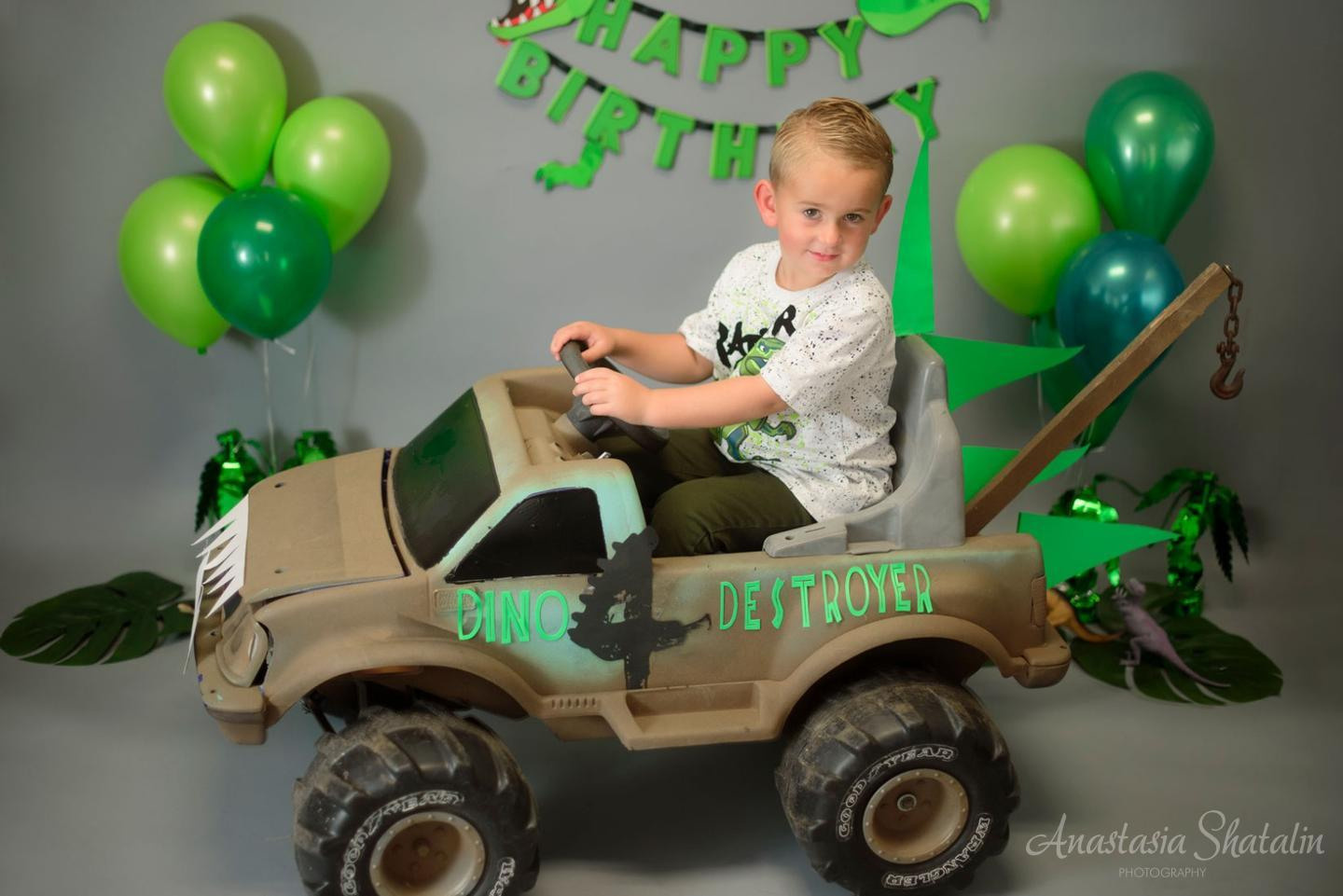 Dinosaur monster truck decorated birthday photography in Lincoln, CA. Family photographer in Roseville, Rocklin, Folsom, Sacramento