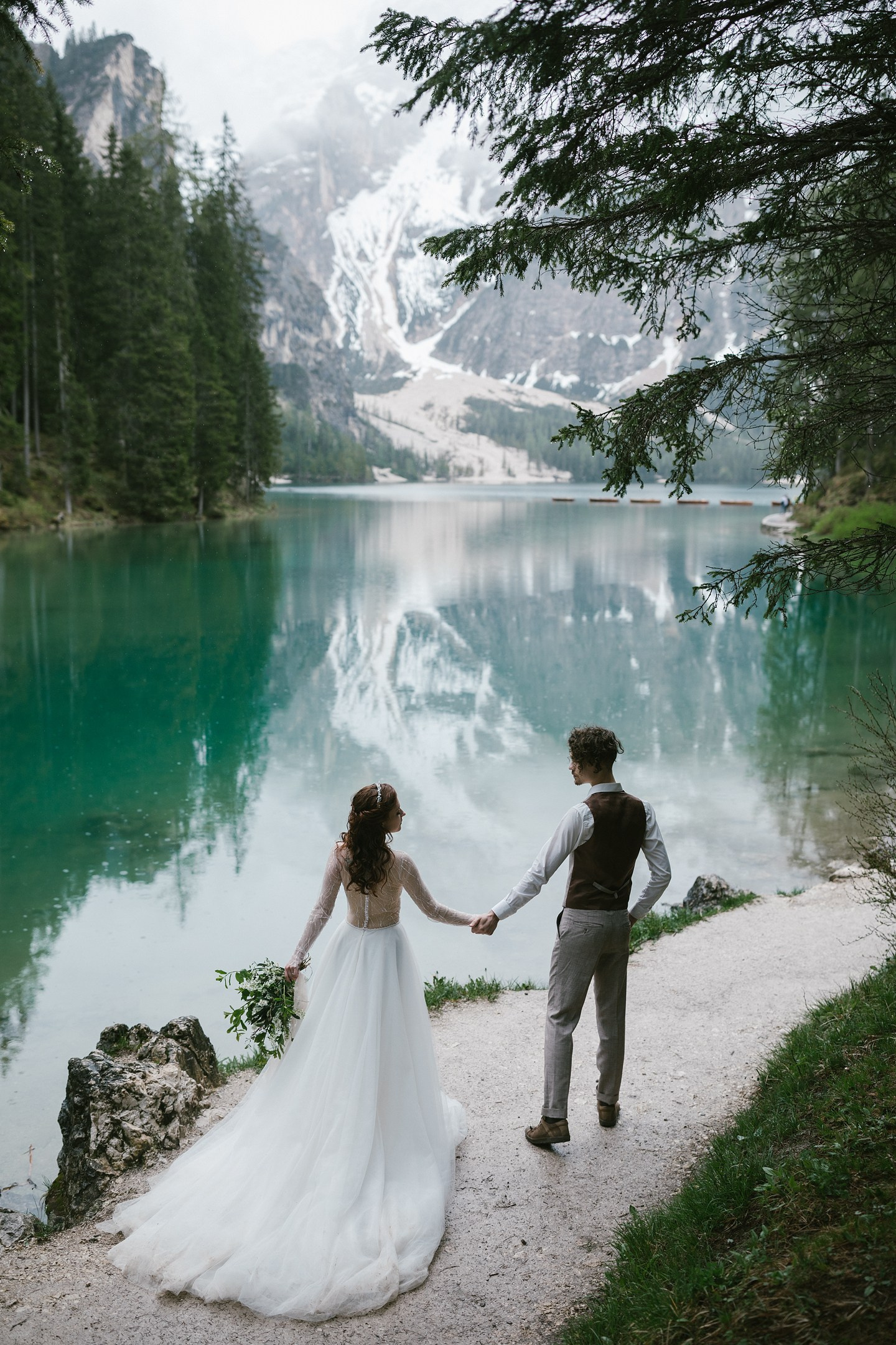  Couple by Lago di Braies, mountains behind