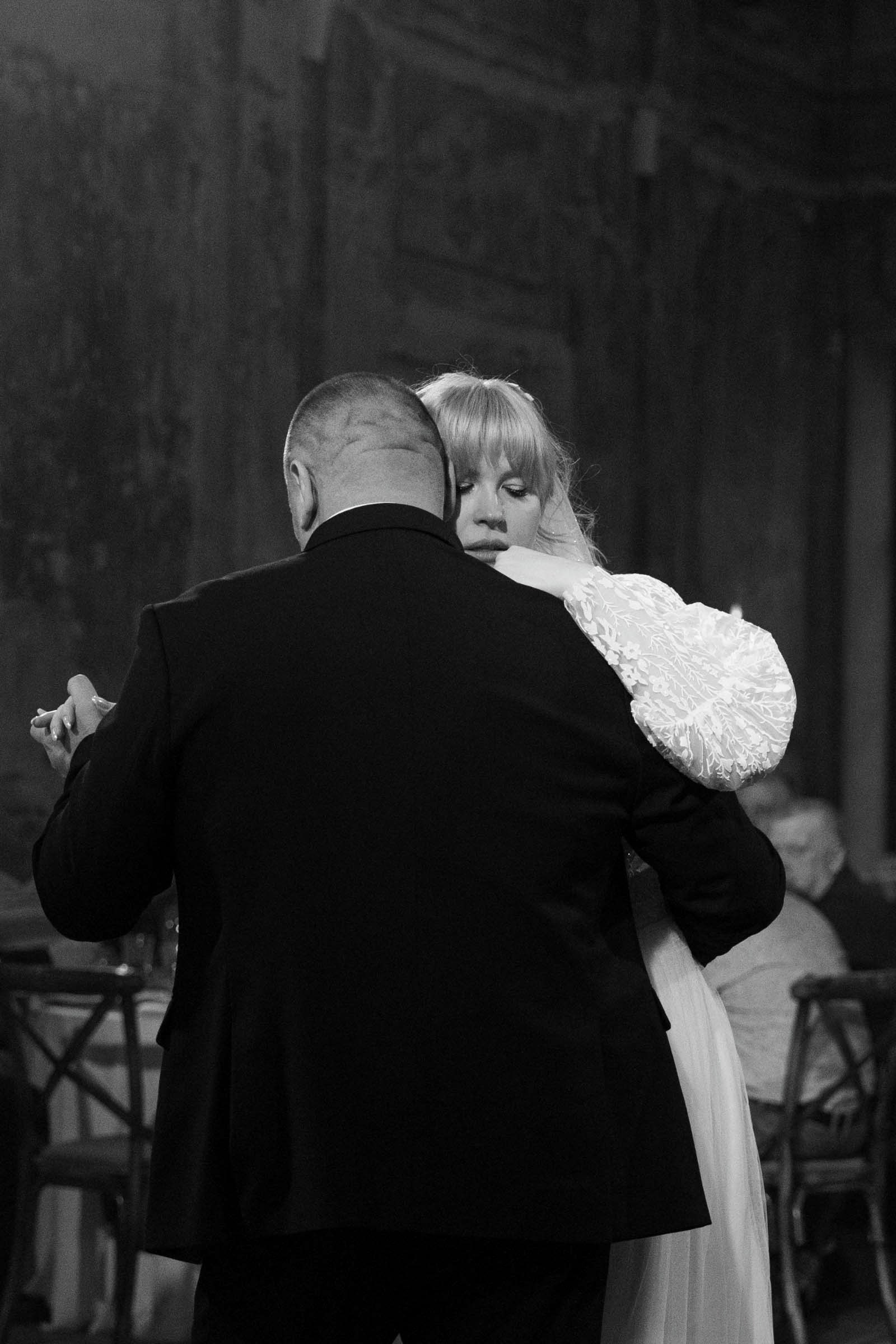 Elopement couple embracing on Chicago rooftop at golden hour