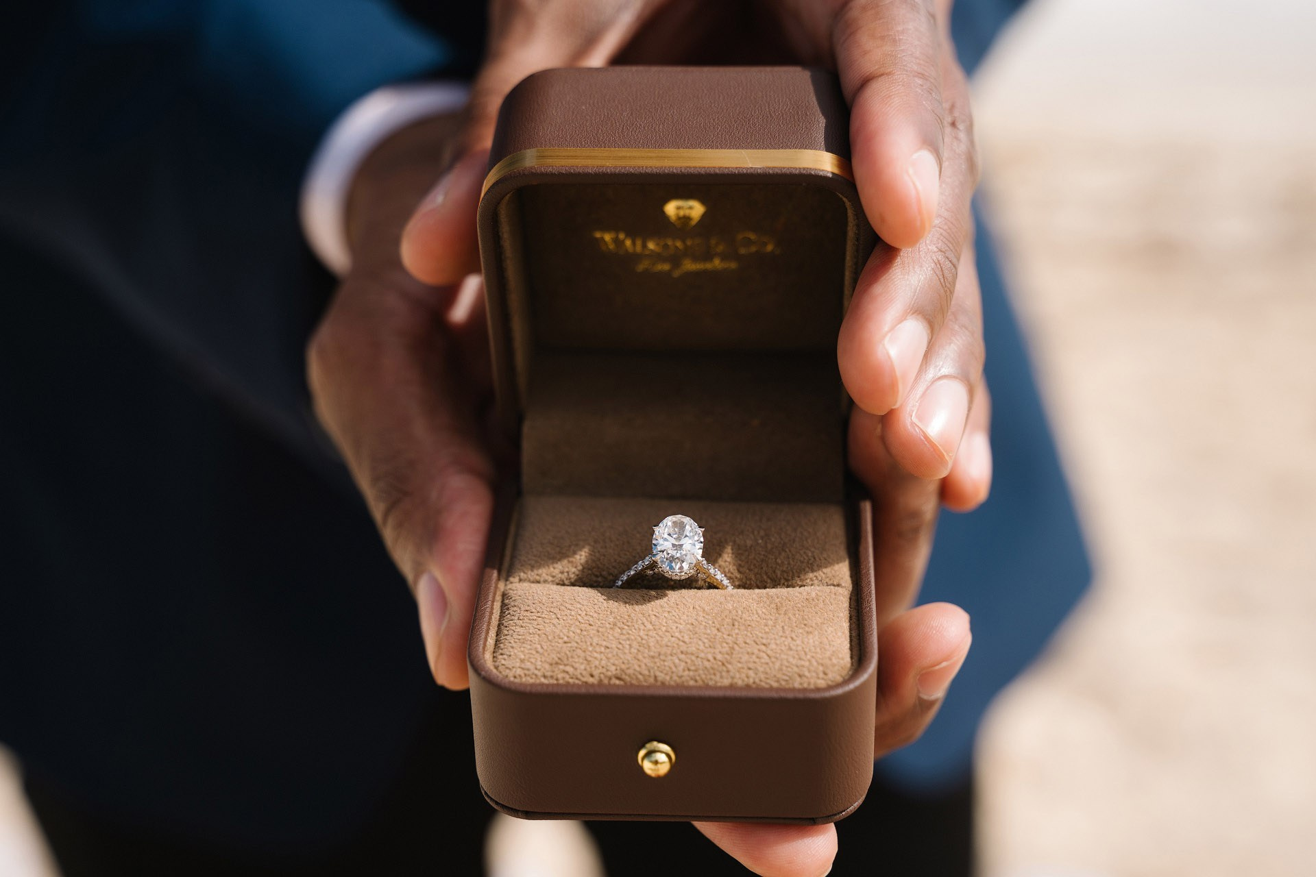 Happy couple celebrating engagement on Punta Cana beach romantic setup