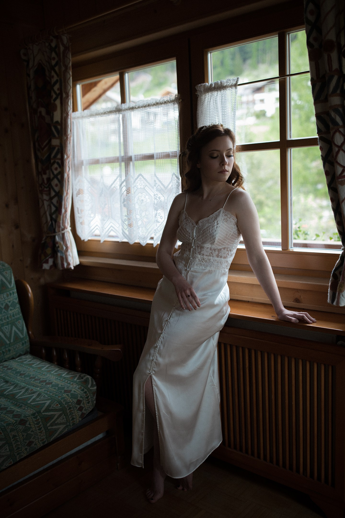Bride in vintage bedroom, soft window light