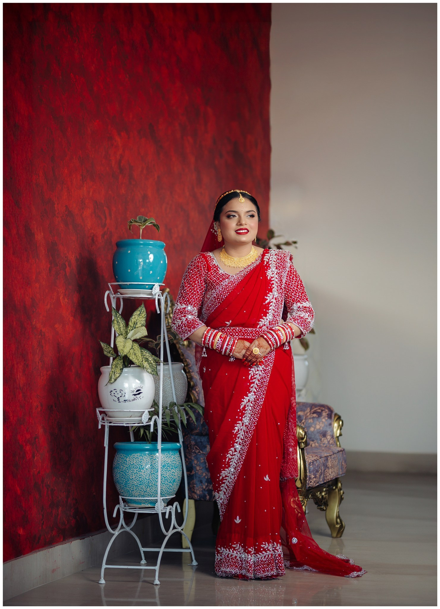 Full length portrait of a gorgeous traditional Nepali bride in red saree kathmandu Nepal