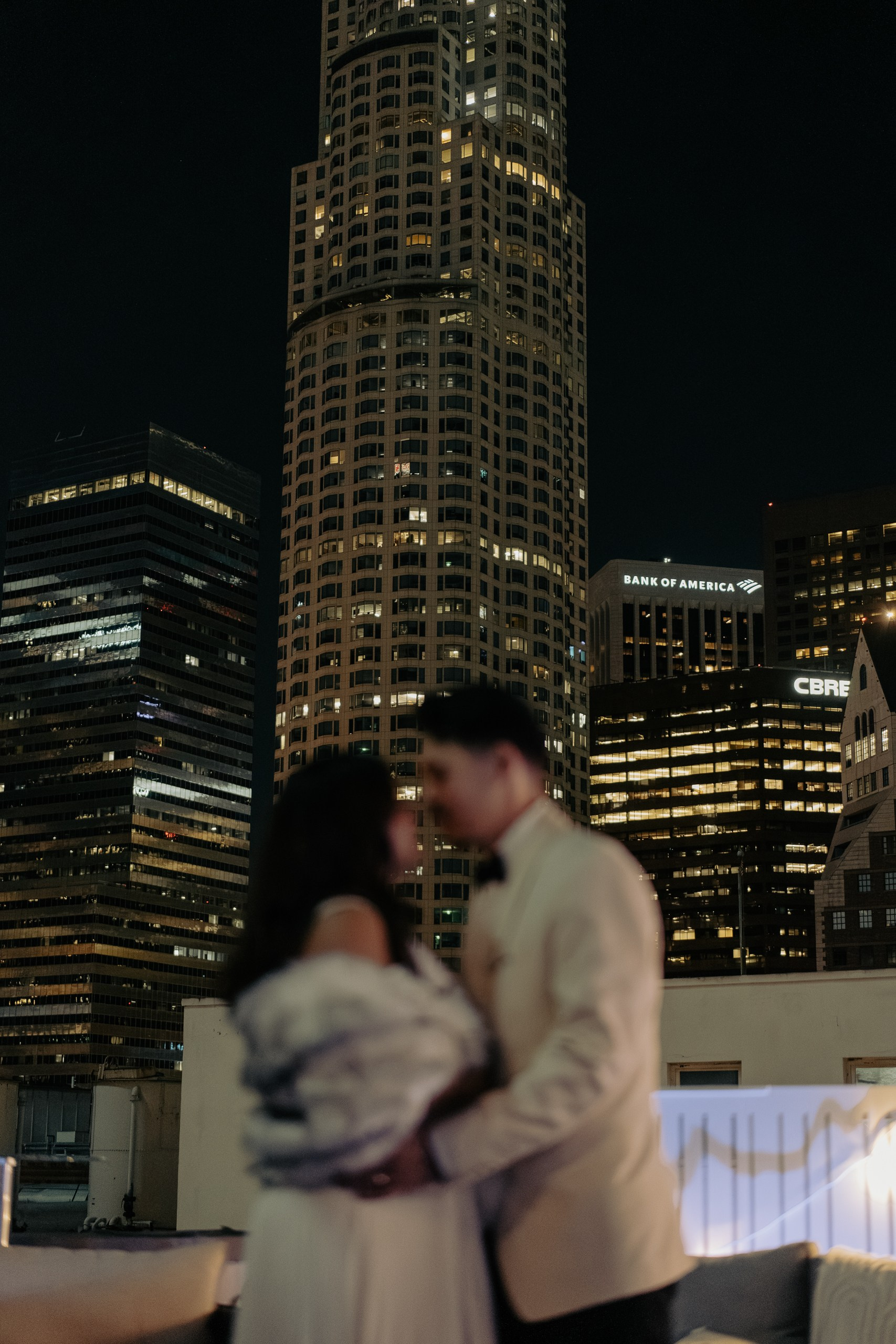 Wedding photo of newlyweds captured in front of Los Angeles city skyline 